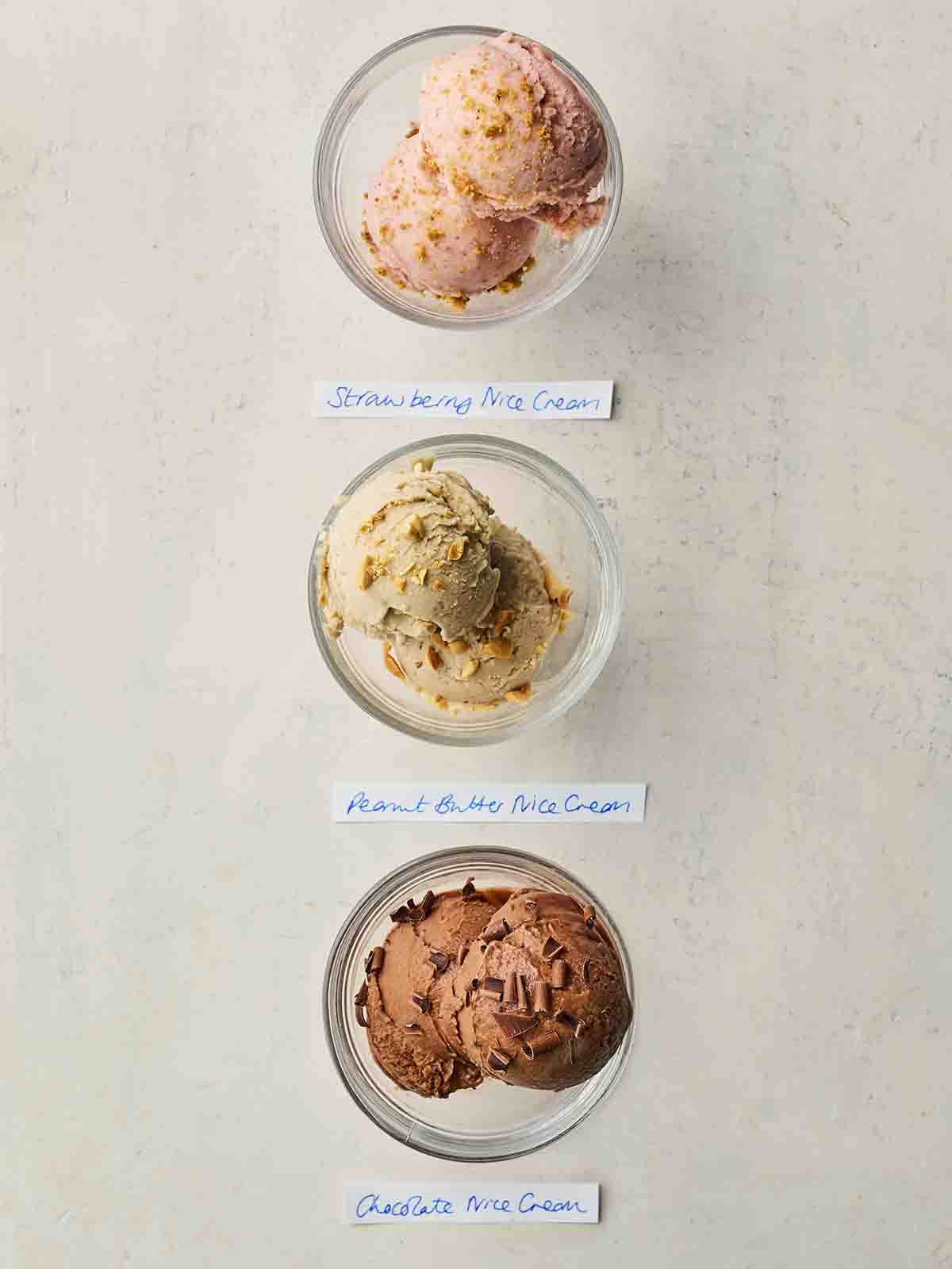 Three bowls in a row with different flavoured Nice Cream flavours, with labels.