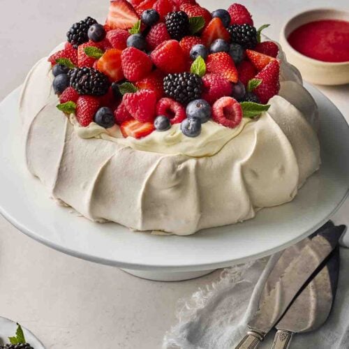 A homemade dessert filling with meringue, cream and fruit.