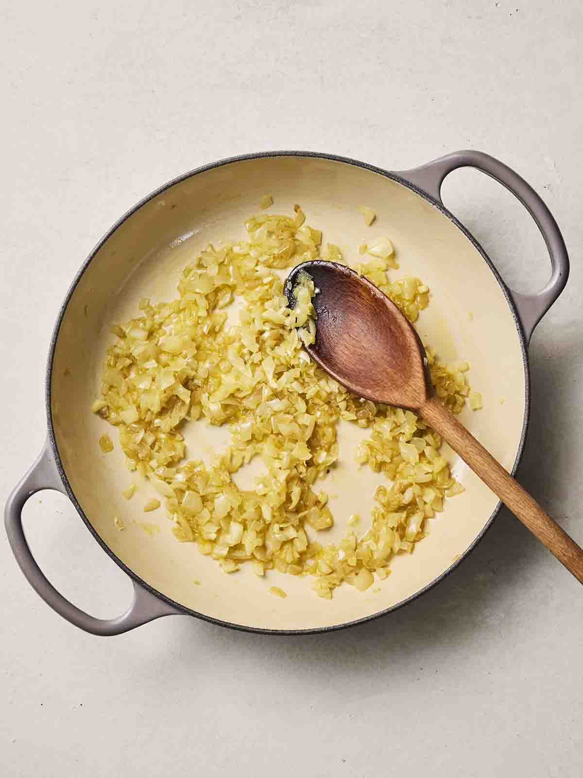 Onions frying in a pan.