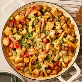 A pan filled with Chicken, Chorizo and Potato Tray Bake, made with roast potatoes cooked in an air fryer.