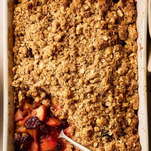 A pudding made with apples and blackberries and a crumble topping.