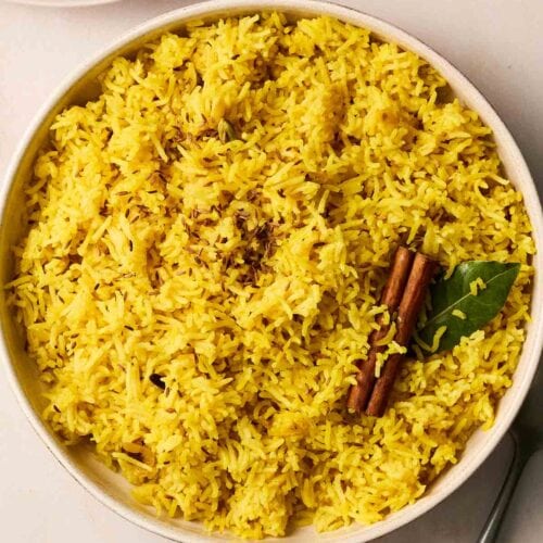 A bowl of yellow rice.