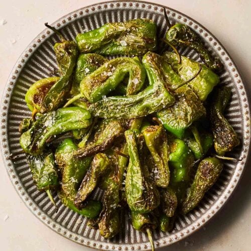 A plate of Spanish tapas peppers with salt.
