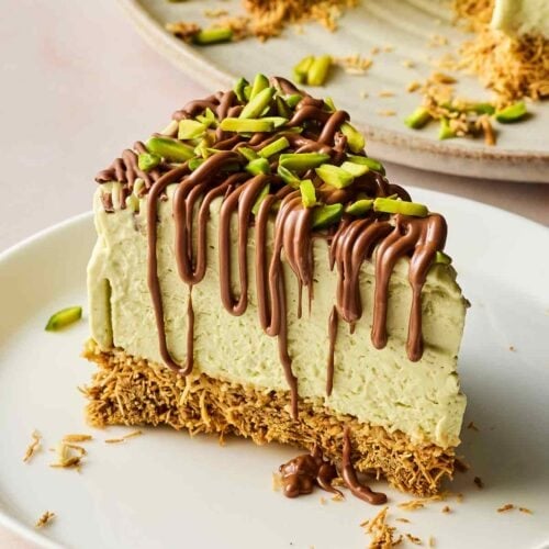 A slice of Dubai Chocolate Cheesecake, ready to eat.