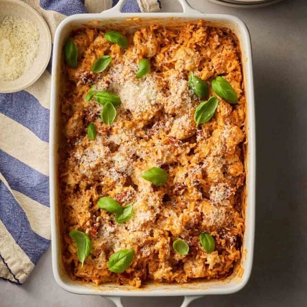 A dish filled with creamy Marry Me Chicken and Rice, ready to serve on a table.