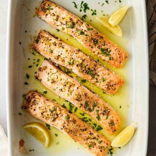 An oven dish with baked salmon, ready to eat.