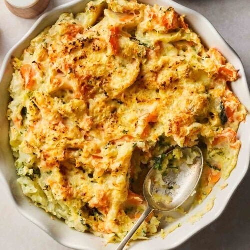 A bowl of mashed vegetables, made into Bubble and Squeak, being served on a table.