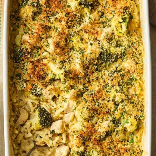 A one pan Chicken Kiev with Orzo pasta meal, on a table ready to eat.