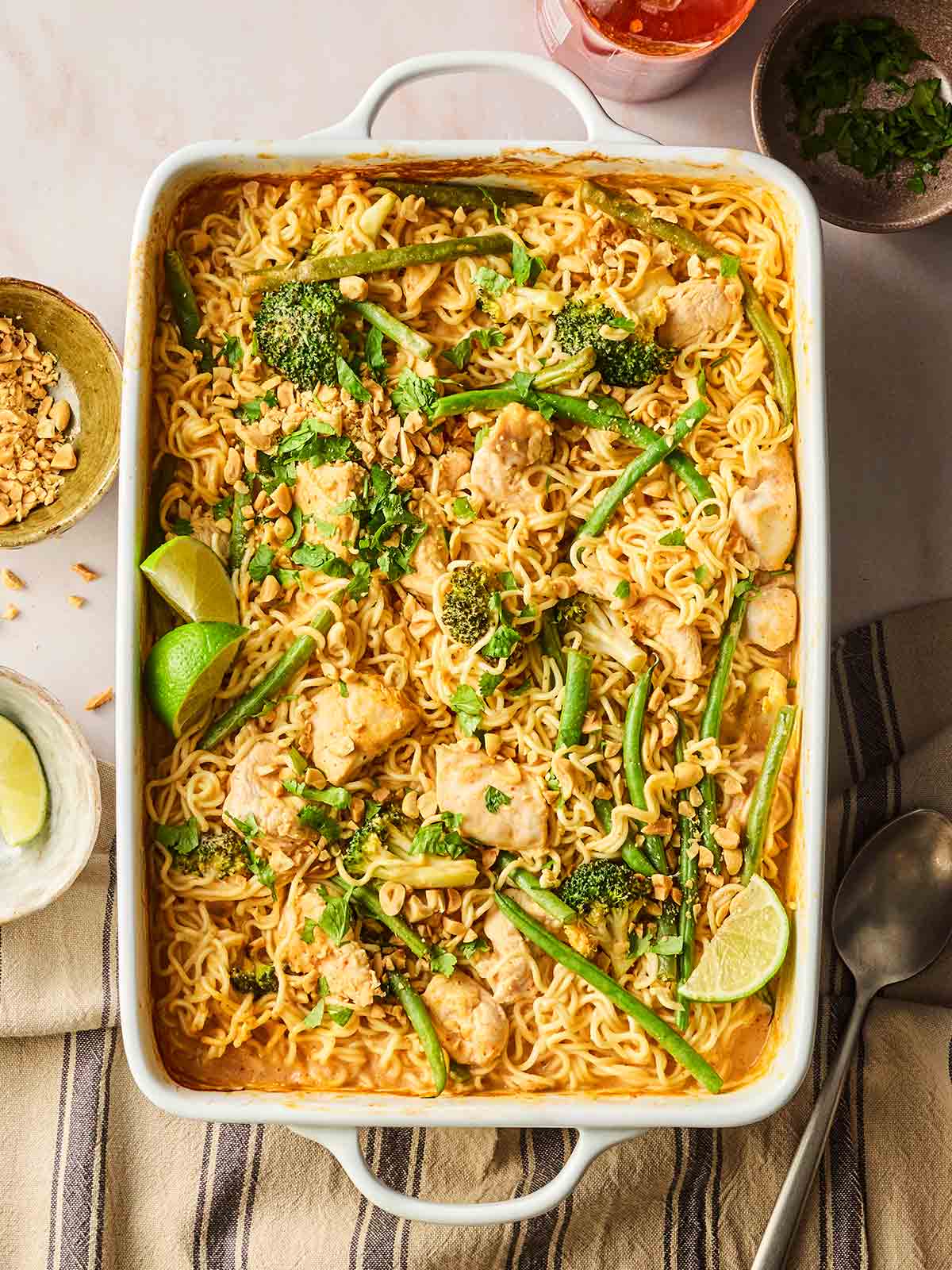 An oven dish filled with a one pan dish of chicken, noodles and vegetables.