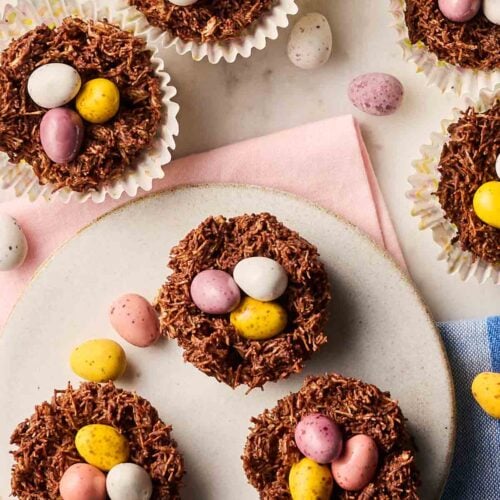 A fresh batch of Easter Eggs Nests on a table, with mini eggs on top.
