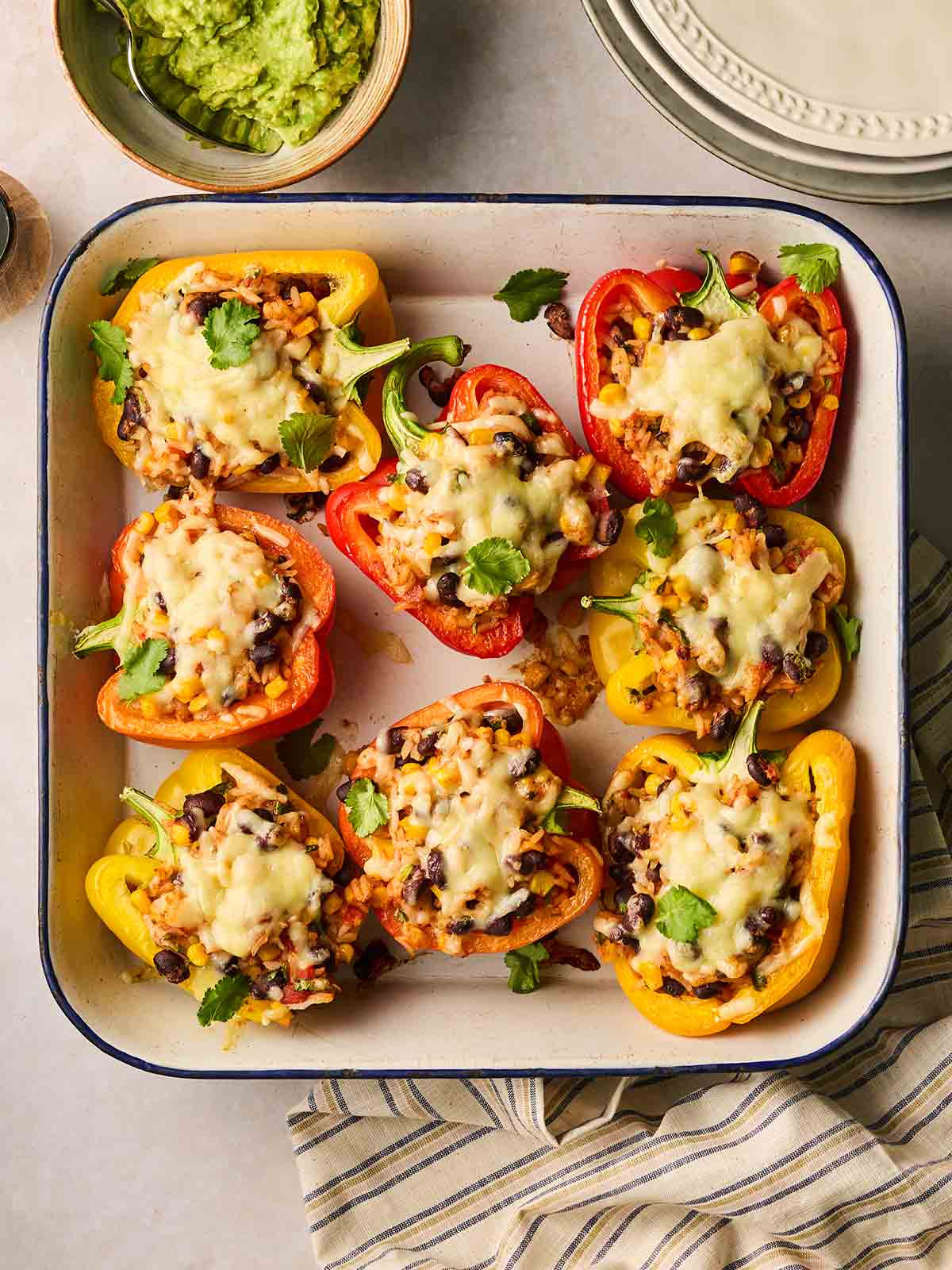 An oven dish with stuffed peppers ready to eat.