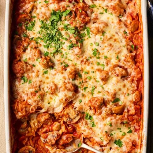 Sausage Orzo one pot dinner with cheese on, all baked in one pan.